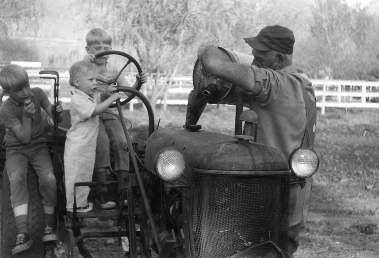 Scott on Tractor as Kid